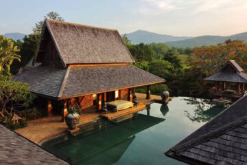 Exterior of Howie's HomeStay pavilion with pool view