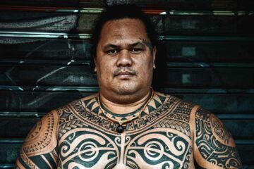 Local man sporting traditional tattoos in The Islands of Tahiti, French Polynesia