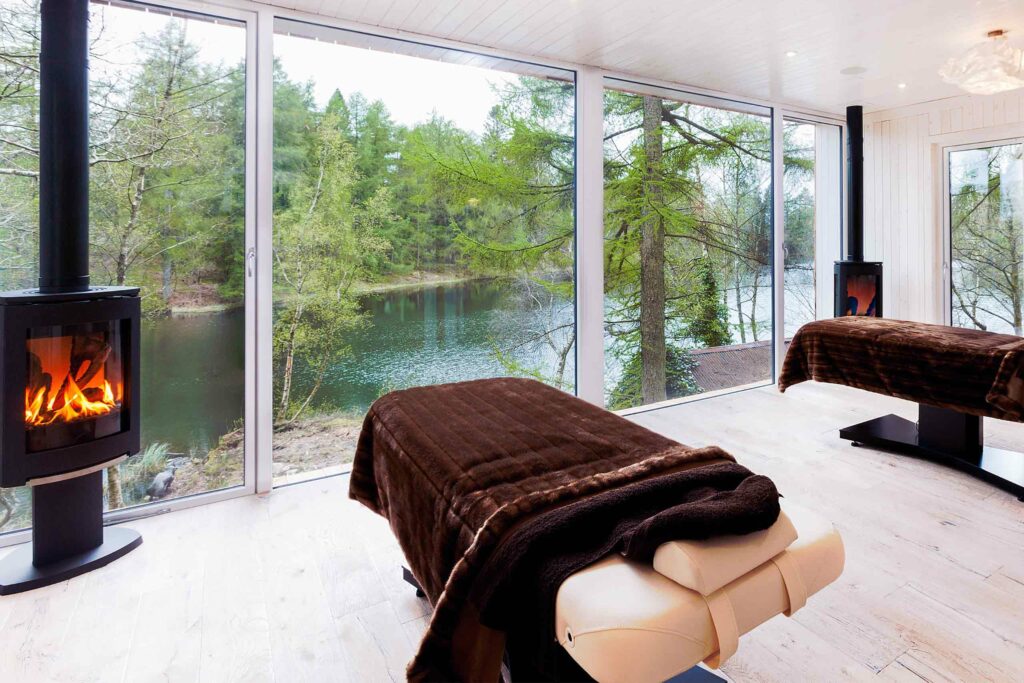 Treatment room with a view over a lake at Gilpin Hotel & Lake House, Windermere, United Kingdom