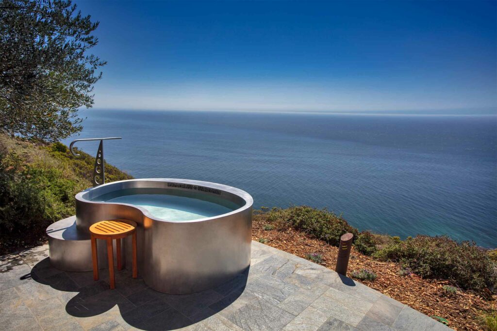 An outdoor jacuzzi with ocean views. 