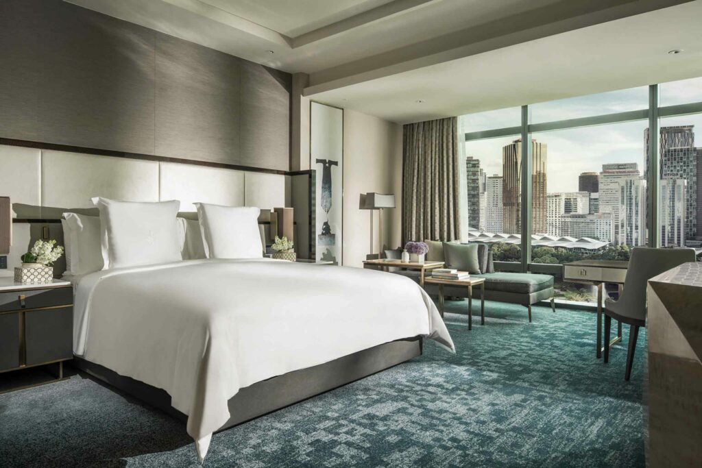 Bedroom suite with prime views of the iconic Petronas Twin Towers at the Four Seasons Kuala Lumpur, Malaysia.