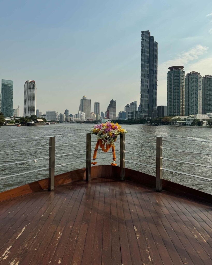 Views of the Chao Phraya River and skyscrapers ahead of the ship.