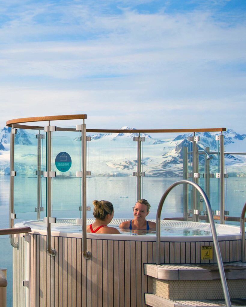 Two women in a jacuzzi aboard the Greg Mortimer