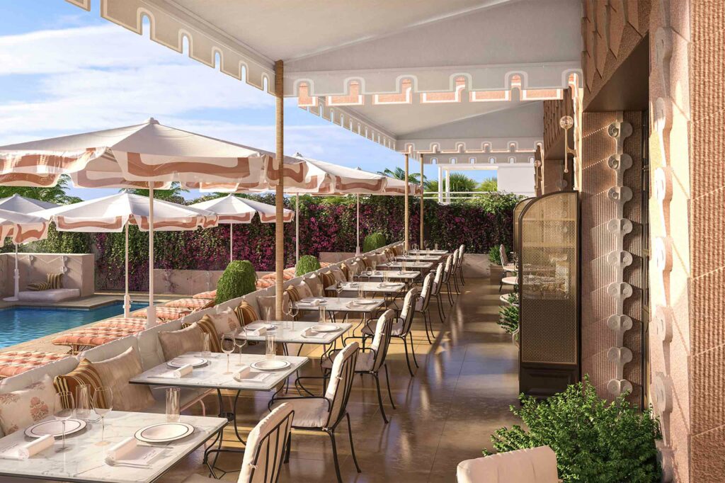 An outdoor terrace with a pool and white umbrellas.