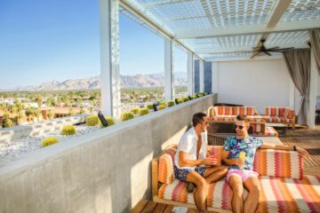 Visit Greater Palm Springs, gay couple at Kimpton Rowan hotel rooftop