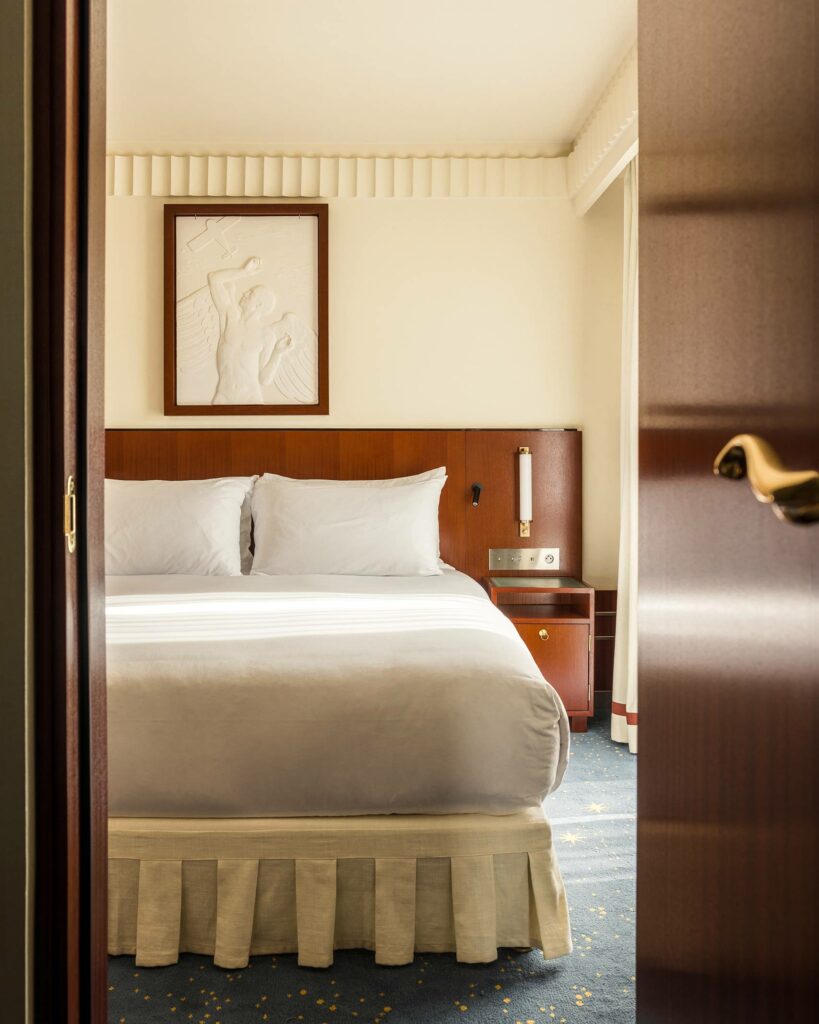 Bedroom interior at Hôtel des Grands Voyageurs, Paris, France