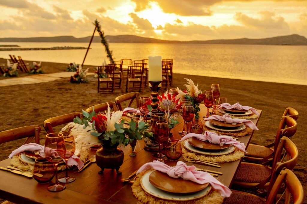 A beachside wedding set-up during sunset hour at W Costa Navarino, Greece