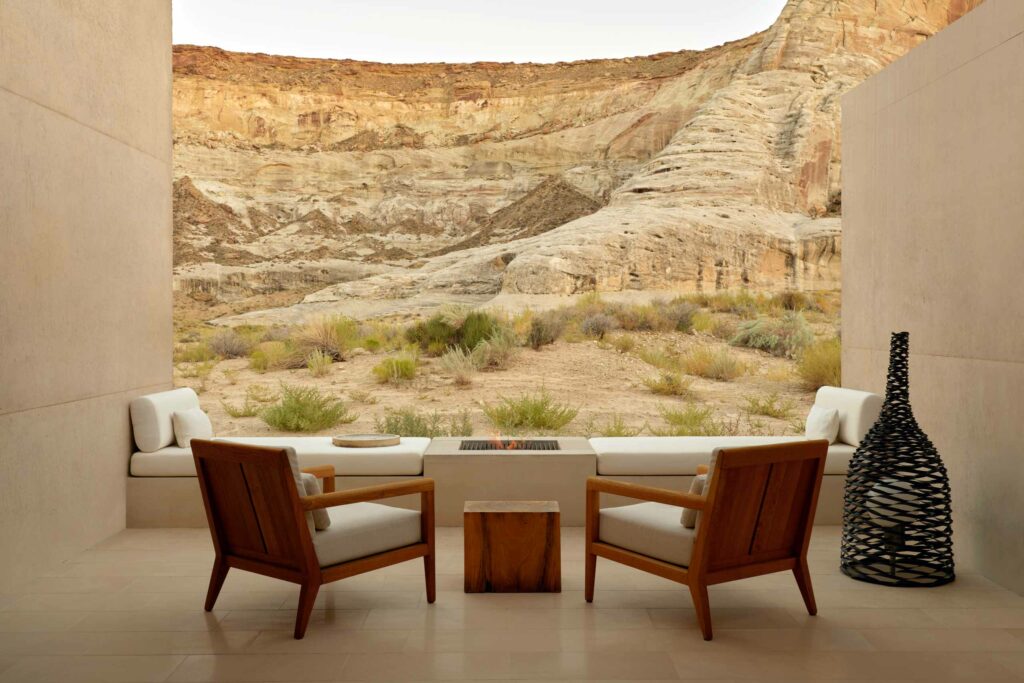 Seats look out towards the rocky landscape of Utah at Amangiri, Lake Powell, Utah, USA