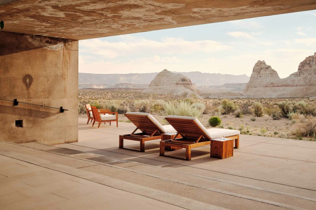 Outdoor loungers look out over the desert landscape at Amangiri, Lake Powell, Utah, USA