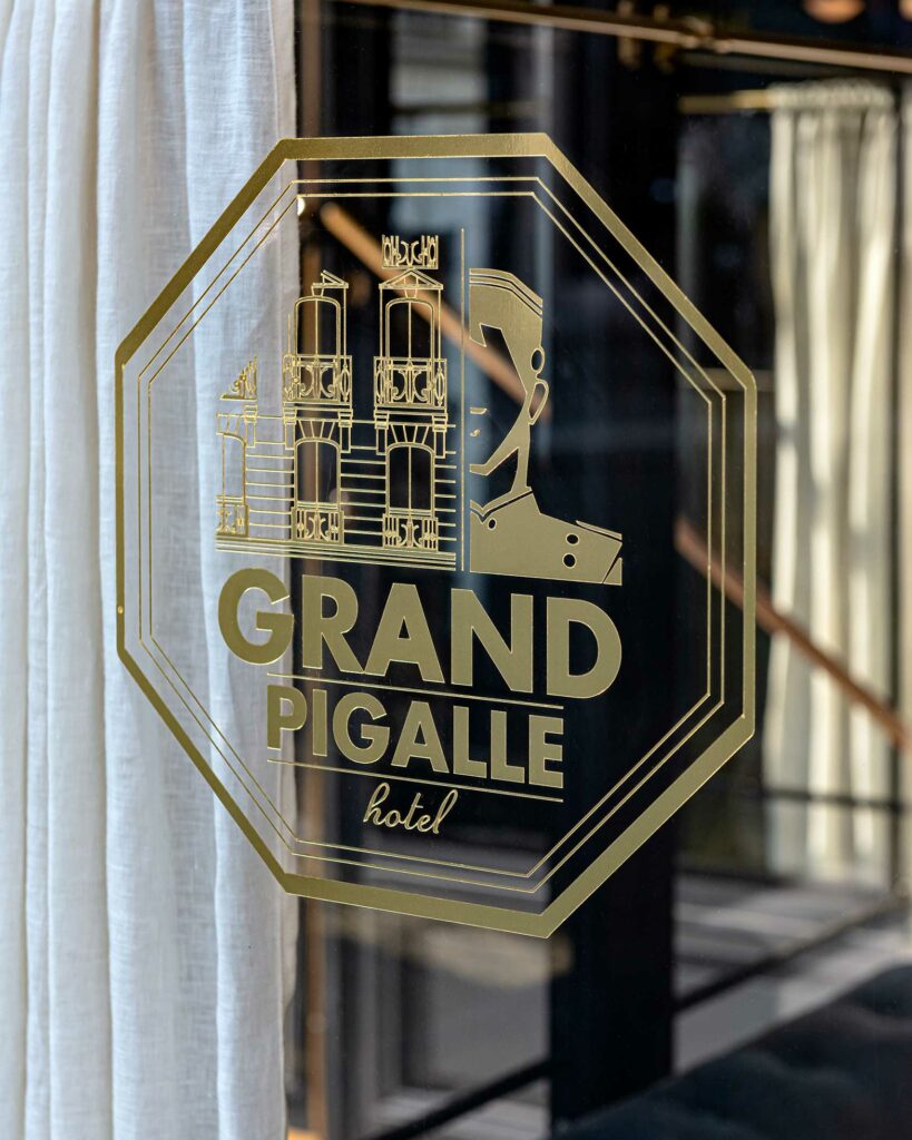 Sign in the window of the Grand Pigalle Experimental, Paris, France