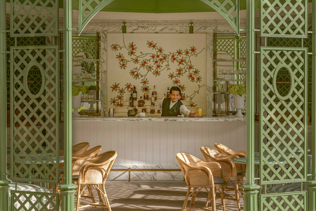 A bartender serves a drink at Saint James Paris, Paris, France