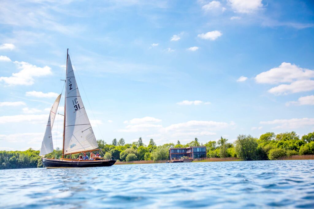 A sailing boat on a lake at The Lakes by Yoo, Cotswolds, England, United Kingdom