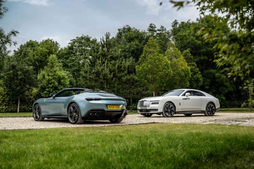 A Ferrari and a Rolls-Royce parked in the Cotswolds as part of a collaboration with Auto Vivendi Supercar Club