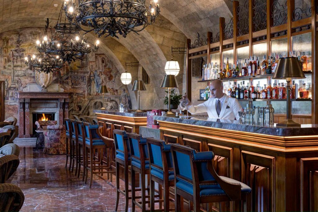 A bartender prepares a drink at Villa Igiea, a Rocco Forte Hotel, Palermo, Sicily, Italy