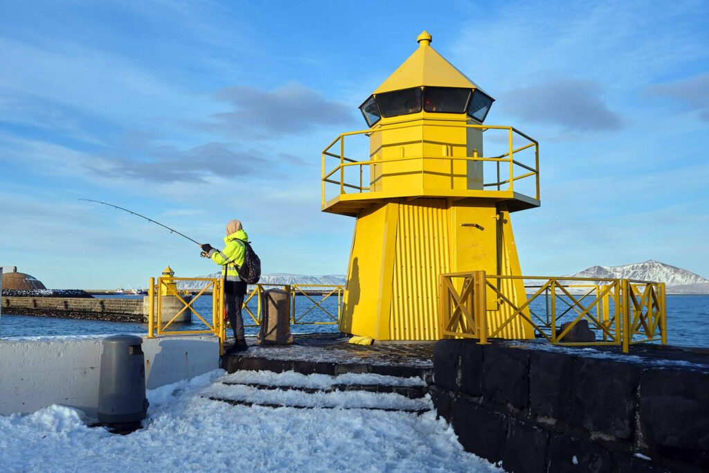 A small, yellow lighthouse in Reykjavik, shot on a Fujifilm X-S20 camera