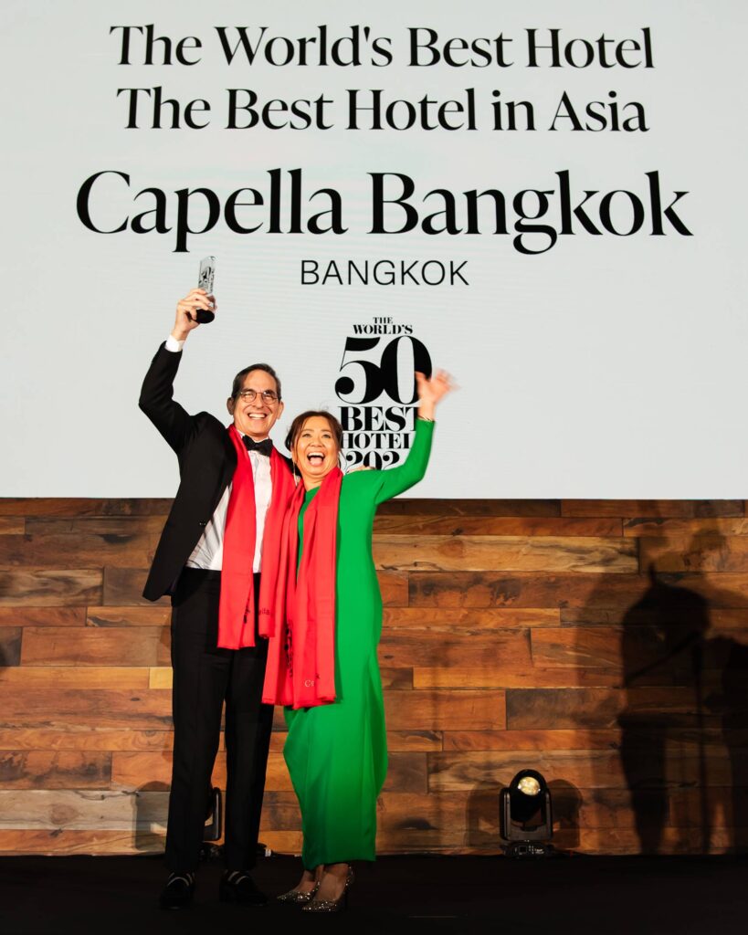 John Blanco and Josephine Png of Capella Bangkok, winners of The World's 50 Best Hotels 2024 celebrate on stage at London's Guildhall