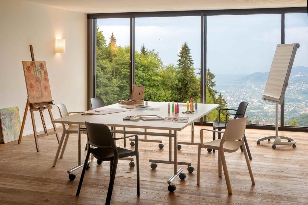 An art therapy room with views over the Swiss Alps