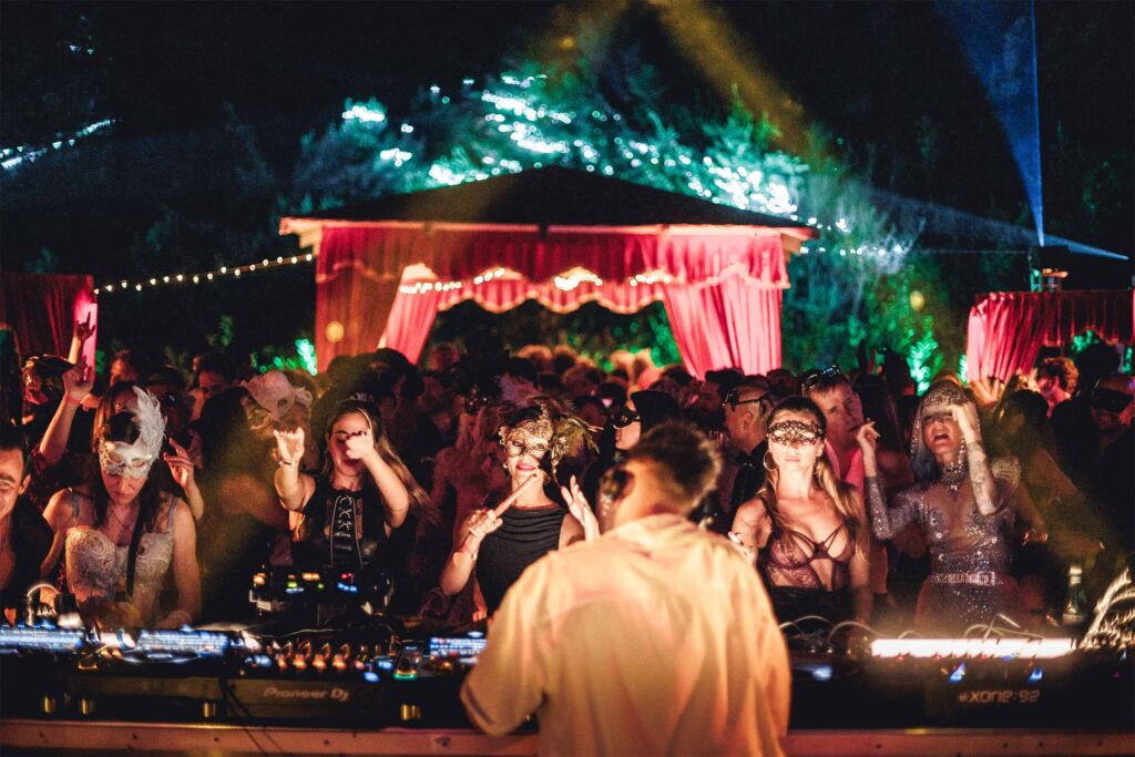 Festivalgoers gathered around a DJ.