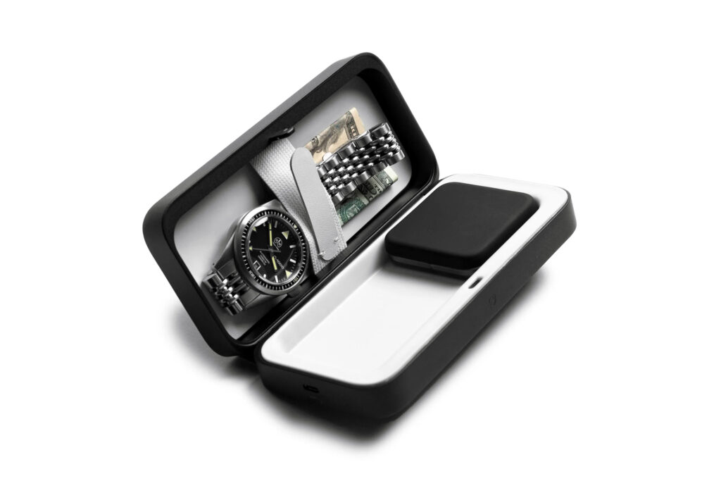 The TROVA GO containing a watch and cash, part of the OutThere travel gadgets gift guide 2024