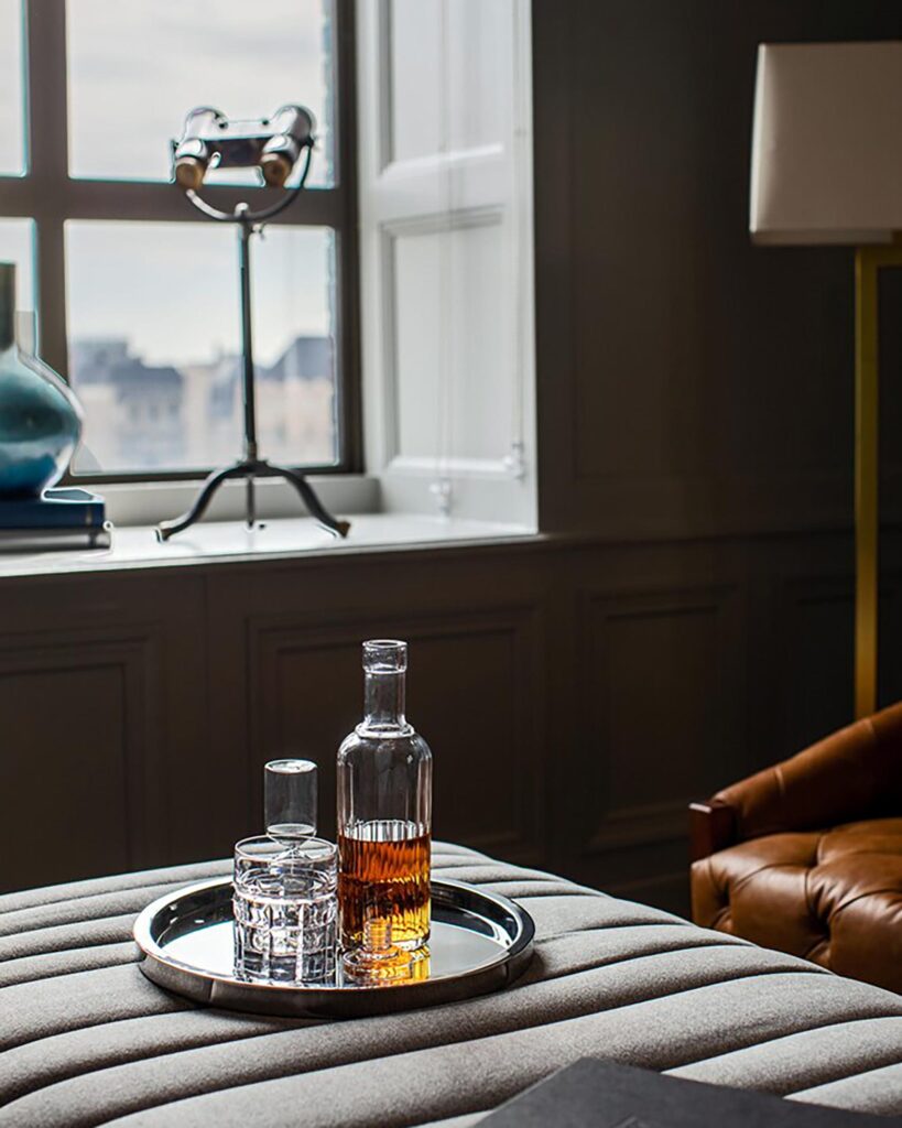 A bottle of bourbon in a hotel room