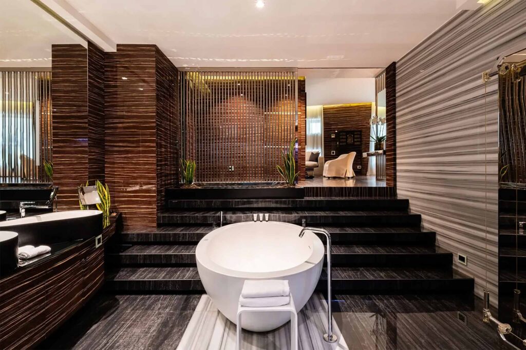 Sophisticated bathroom with freestanding bathtub at ROMEO Napoli, Naples, Italy